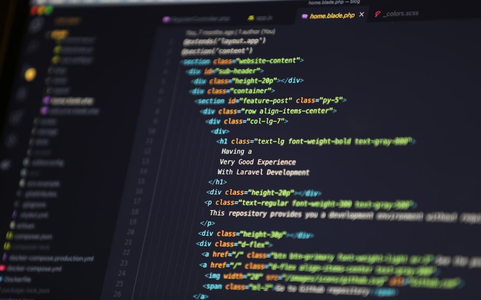 Blade template markup open in a dark code editor
